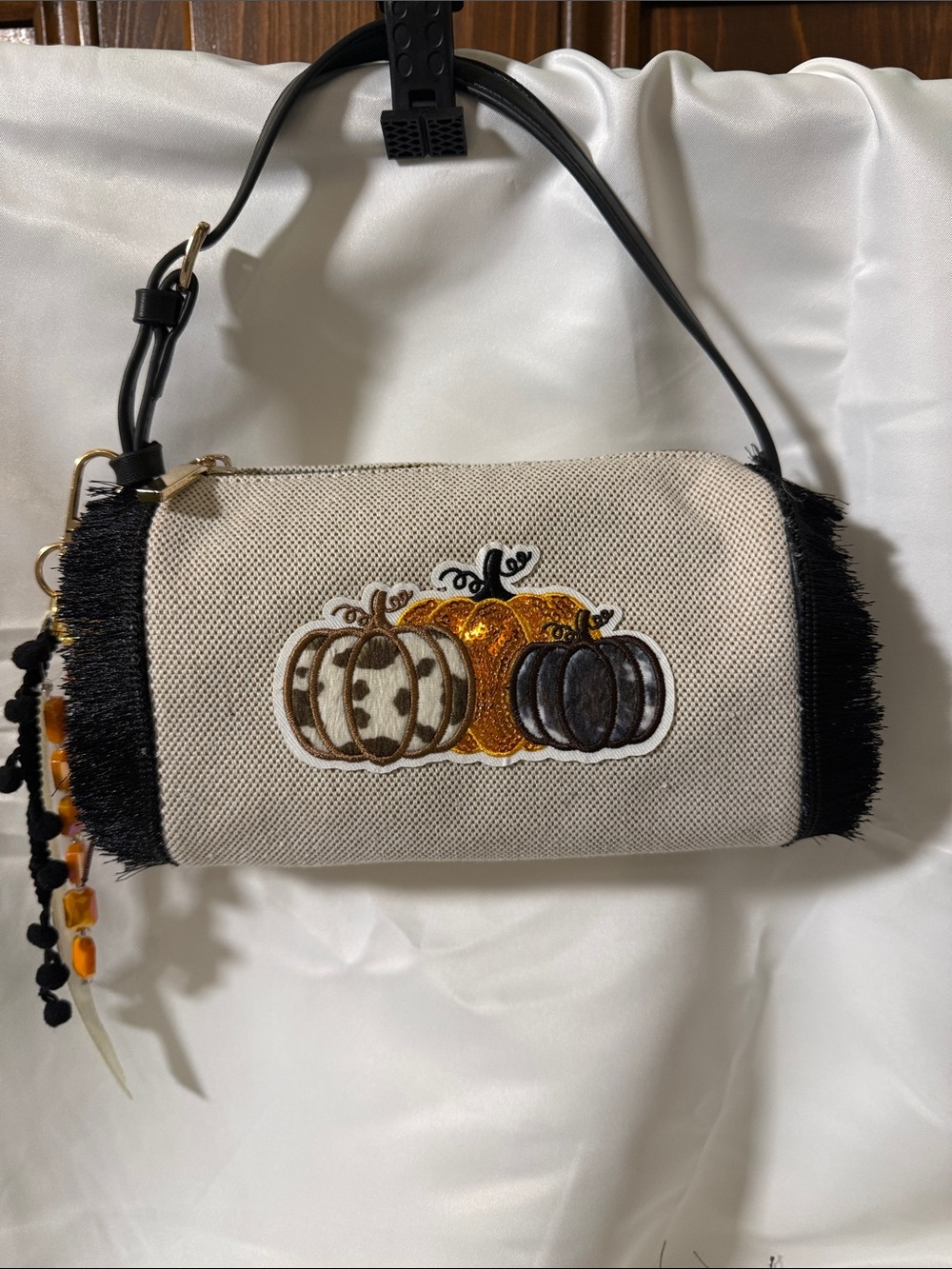 Cream Canvas Pumpkin Appliqué Wristlet with Black Fringe